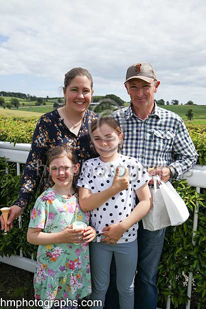 The Ross family - Suzanne and Ronnie with children Hannah and Katie enjoying themselves at The Family Fun Raceday at Downpatrick Race Course on Wednesday 13th July 2022.