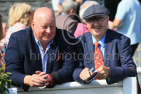 Peter Magill, a Director of Downpatrick Racecourse and Framkie Fitzimmons, Turf Club Official enjoying the sunshine at Downpatrick Racecourse ladies Day on Monday