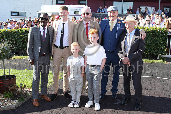 The finalists on the Men's Best Dressed Compatition at teh Downpatrick Racecourse Ladies Day on MOnday. Pius Kulina (left of picture) won the competition received a voucher for £500 for Warnocks