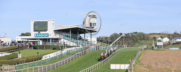 No spectators at the Ulster National Steeplechase Meeting at Downpatrick as horses race up the hill on Sunday