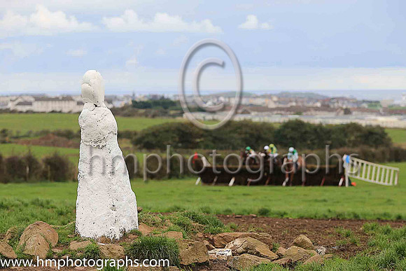 Horses at the Route Point-To-Point Steeplechases at Portrush pass the The White Wife, an ancient stone. <br/><br/>http://www.irishmegaliths.org.uk/derry.htm