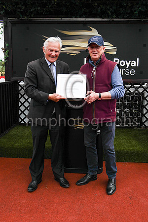 Mark Kershaw presenting a prize to a representative of the winning trainer Joseph O'Brien