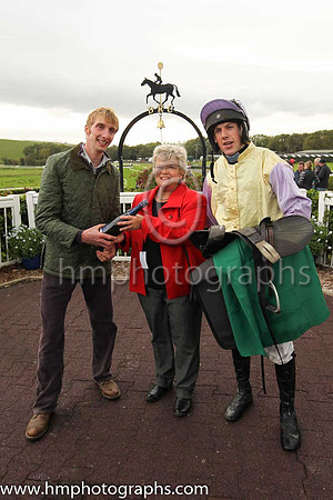 June Millar , Director of Kelso Racecourse presents the winners trophy to trainer Ben Arthey and jockey Brian Hayes after Mister To Mister ( 8 , yellow, mauve sleeves ) Owner - C Gault won The Scottis