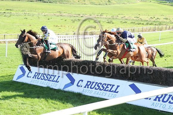 Shantou Sisu and Danny Mullins (dark blue, orange sleeves) winners of Race 6 The Downpatrick Handicap Steeplechase