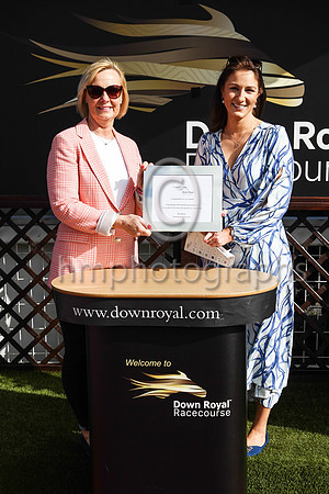 Una Manning, wife of jockey Kevin and daughter of trainer Jim Bolger receiving the trophy from Susan McCartney after Dancila won Race 7 - The Watch Racing TV with free Trial Now Maiden at the Boylespo
