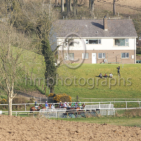 Spectators watch the racing in the sunshine at Downpatrick on Sunday