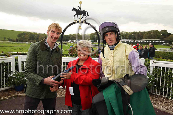 June Millar , Director of Kelso Racecourse presents the winners trophy to trainer Ben Arthey and jockey Brian Hayes after Mister To Mister ( 8 , yellow, mauve sleeves ) Owner - C Gault won The Scottis