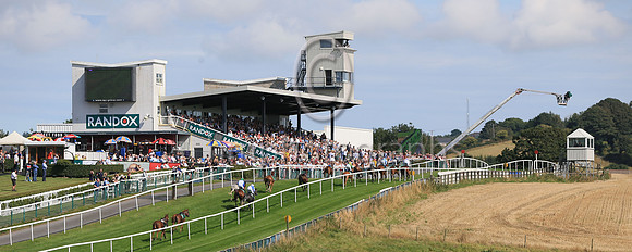 Racing up the Hill in the sunshine on the first of two circuits of the Course to large crowds at the Downpatrick Racecourse Ladies Day Meeting on Monday