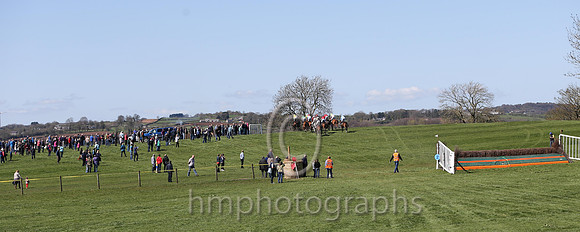 Large crowds watch the racing on the hill in the centre of the new course at the Mid-Antrim Hunt Point to Point at Broughshane near Ballymena
