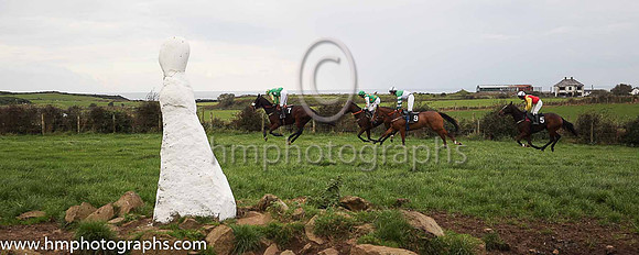 Maddy, Frankie and Gracie McNally enjoy their lollypops at The Route Point-To-Point Steeplechases at Portrush