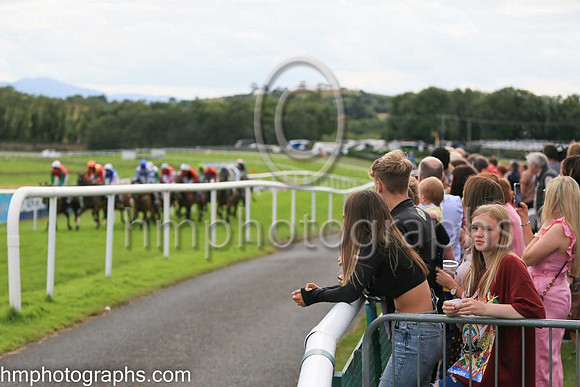 Spectators watching the racing at The Family Fun Raceday at Downpatrick Race Course on Wednesday 13th July 2022.