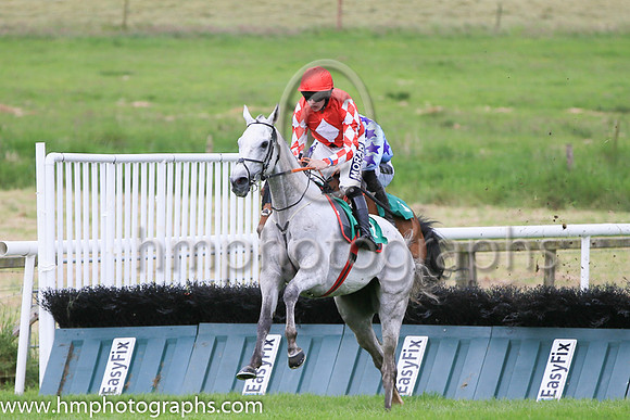 Race 1 winner - Roaring Potter ridden by Shane Fitzgerald in red colours with white diamond, number 1