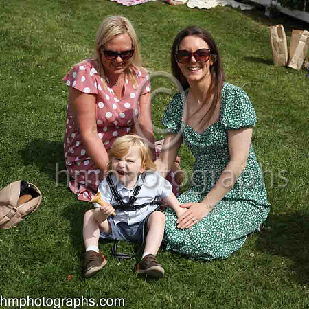 Sisters Bridie Armstrond and Jenny Murray with Lee Murray enjoying the sunshine at The Family Fun Raceday at Downpatrick Race Course on Wednesday 13th July 2022.