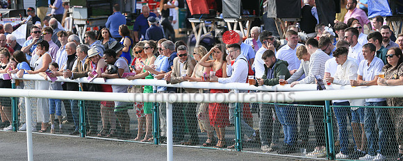 Spectators waiting for the horses to appear at Ladies Day at Downpatrick Racecourse on Monday