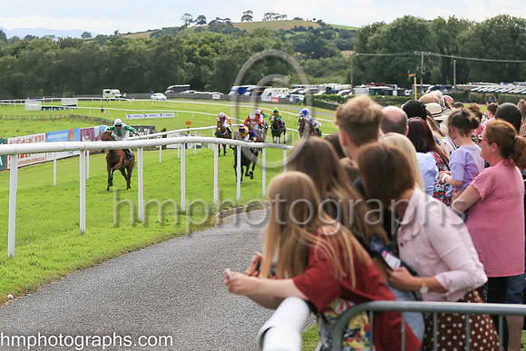 Spectators watching the finish of Race 4 - The North Down Maqruees Handicap Hurdle at The Family Fun Raceday at Downpatrick Race Course on Wednesday 13th July 2022.