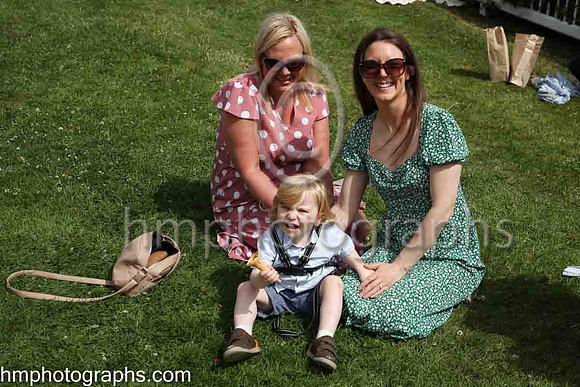 Sisters Bridie Armstrond and Jenny Murray with Lee Murray enjoying the sunshine at The Family Fun Raceday at Downpatrick Race Course on Wednesday 13th July 2022.