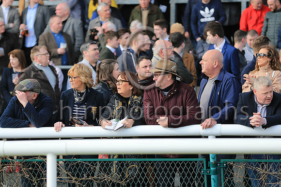 Watching for the horses at Downpatrick Races