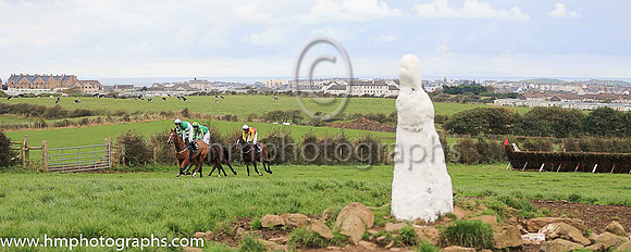 Horses at the Route Point-To-Point Steeplechases at Portrush pass the The White Wife, an ancient stone. <br/><br/>http://www.irishmegaliths.org.uk/derry.htm
