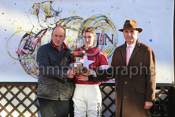 James Nicholson presenting the trophy to Jack Kennedy jockey and Ian Almond representing the Owners Gigginstown House Stud after Outlander won the JNWINE.COM Champion Chase at Down Royal.