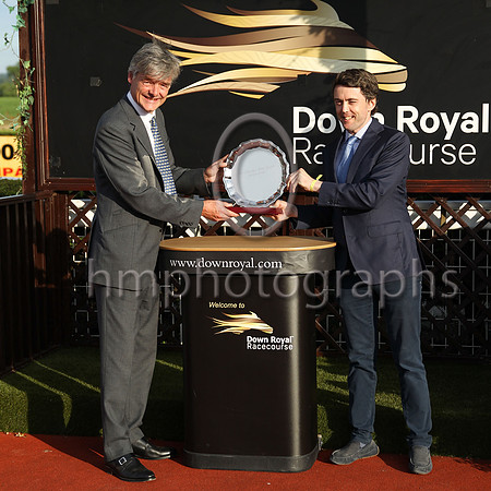 Gawn Rowan-Hamilton Lord Lieutenant of County Down presenting Her Majesty's Plate to Chris Armstrong representing the owners of Perotan winner of Her Majesty's Plate (Listed Race) at Down Royal on 22n