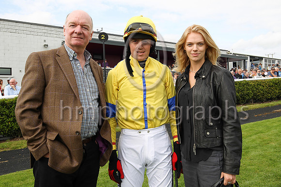 John Taylor with jockey Keith Donoghue and his daughter Sarah at Downpatrick Races. Sarah is taking a holiday at home from her job as a model with IMG in New York.John's horse Blue Empyrean trained b